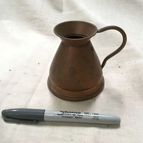 Small copper wide based jug