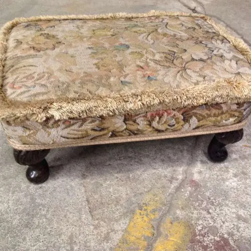 wood foot stool with distressed fabric cushion