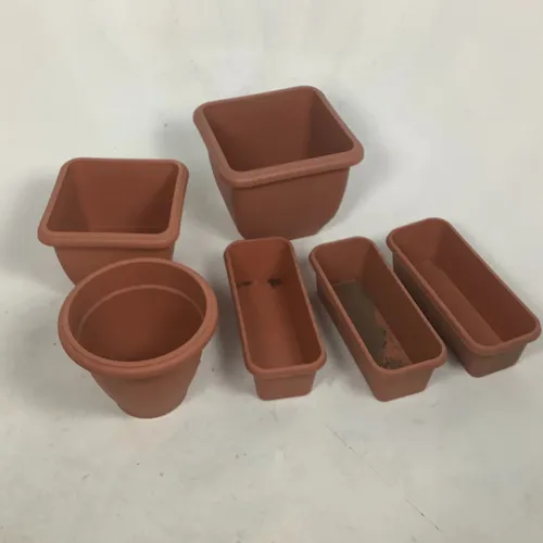 Various terracotta plastic planters