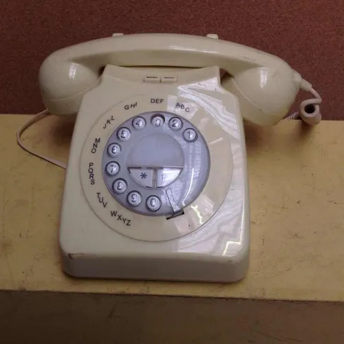 cream corded push button telephone