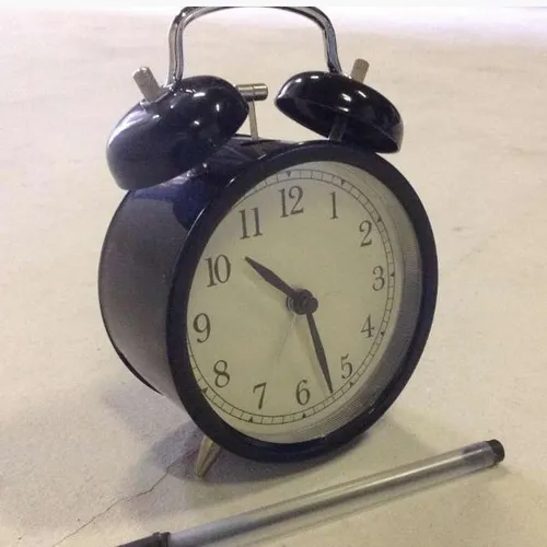 black metal analogue twin bell alarm clock