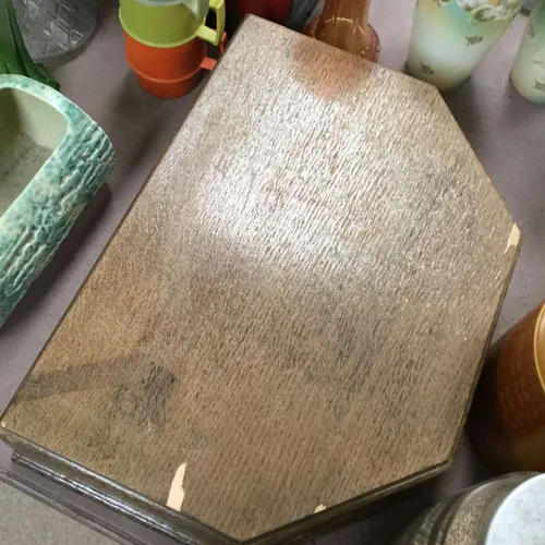 Large wooden box with assorted cutlery items inside