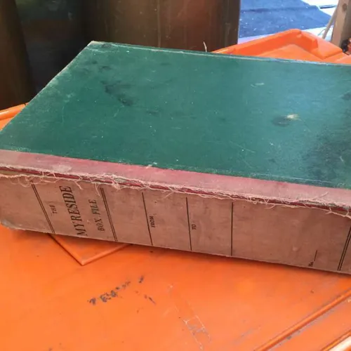 well-worn Myreside Box File with faded, frayed red spine