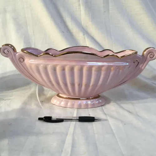 Long pale pink shell like vase with gold trim 