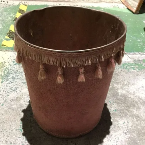 Pink waste paper bin with tassels