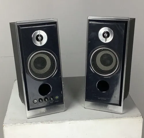 Pair of Black Sony Speakers with Clear Acrylic Border