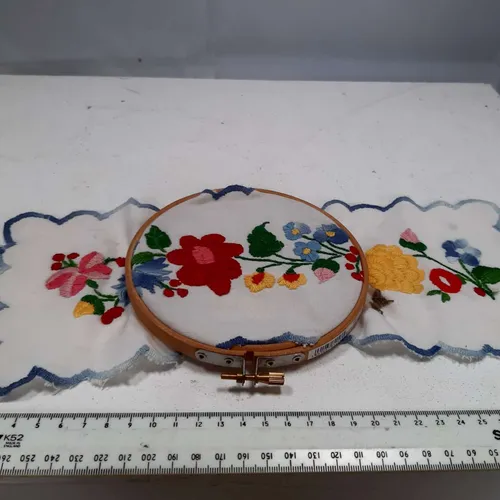 Small embroidery hoop with floral cross stitch cloth