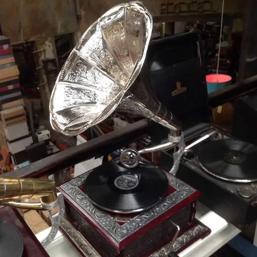 replica gramophone with silver decorative design and silver horn
