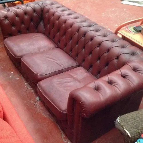 Low back Chesterfield three seater sofa in burnt red