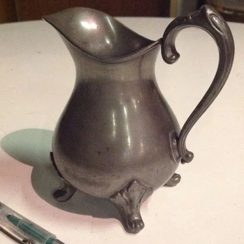 pewter jug with clawed feet
