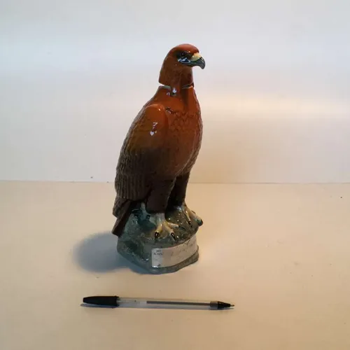 Eagle shaped 'famous grouse' whisky decanter on base with opening neck