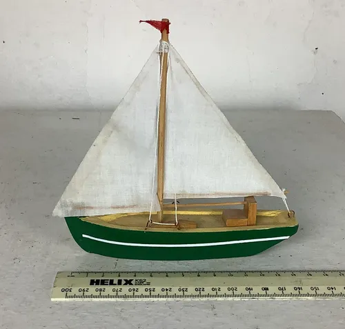 Green and White Model Sailboat