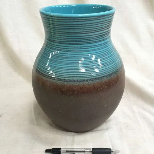 Brown and blue ceramic vase with thin black lines detail