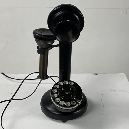 replica of black rotary dial candlestick telephone