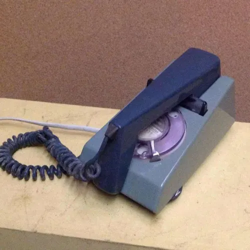 two tone blue corded trimphone with rotary dial