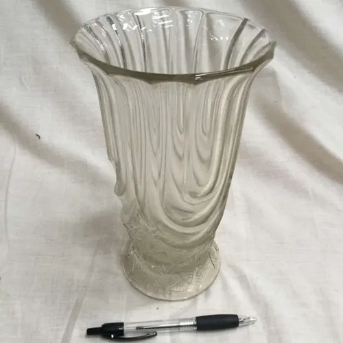 Clear glass vase with wavy material fold detail