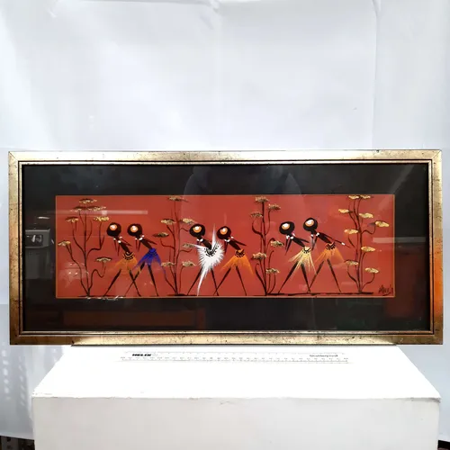 Tribal painting with black border in gold metal frame