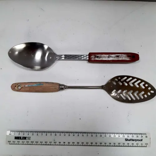 Period metal kitchen utensils with wood handle