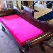 Rustic wooden handcrafted sofa with pink velvet pad