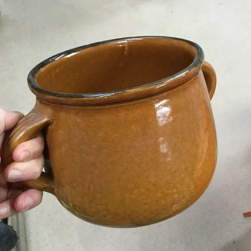 Brown ceramic pot with handles
