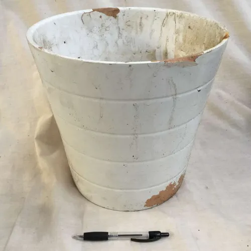 Tall white ceramic plant pot
