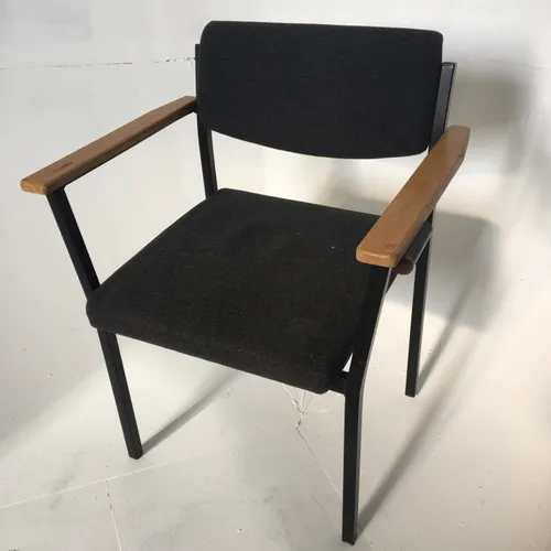 Period stacking office chair with black cushioned seat and backrest, metal frame and wooden arms