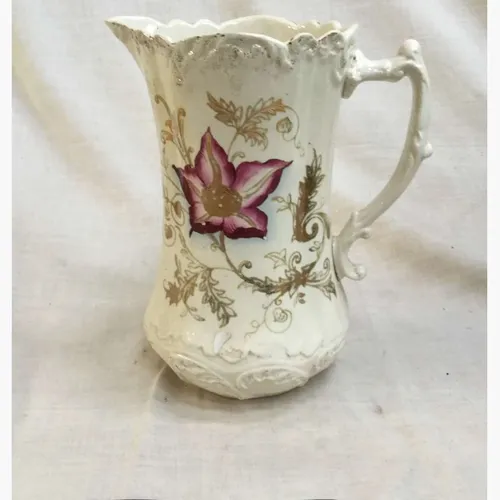 Small china jug with flower and gold detail