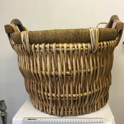 Wicker basket with wooden handles and hessian top