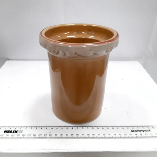 Brown and white ceramic jar 