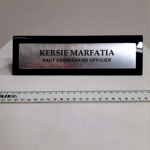 Black plastic and metal nameplate 'Kersie'