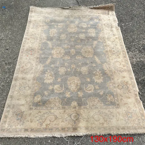 Faded Persian-Style Rug with Floral Detail and Fringe