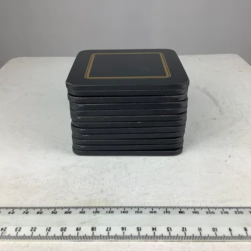 Set of 7 black coasters with gold detail 