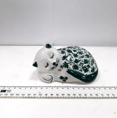 Ceramic sleeping cat figurine