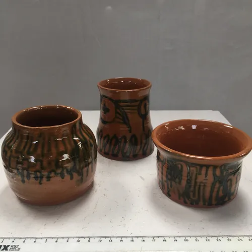 Small glazed terracotta pots with green detail