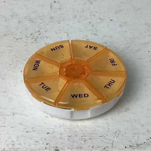 Orange and White Days of the Week Pill Box with Braille
