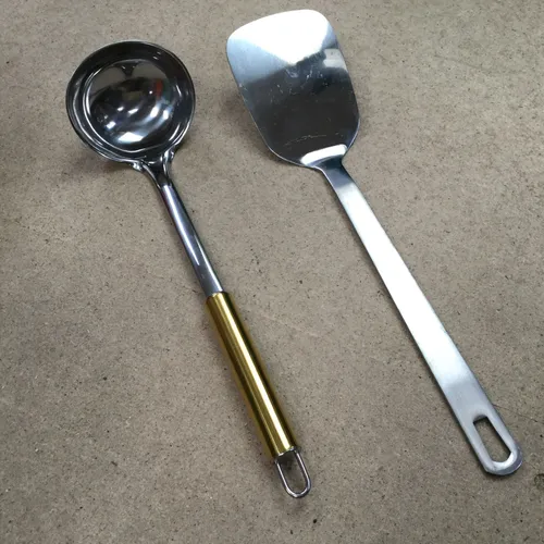 Various silver metal ladle and spatulas 