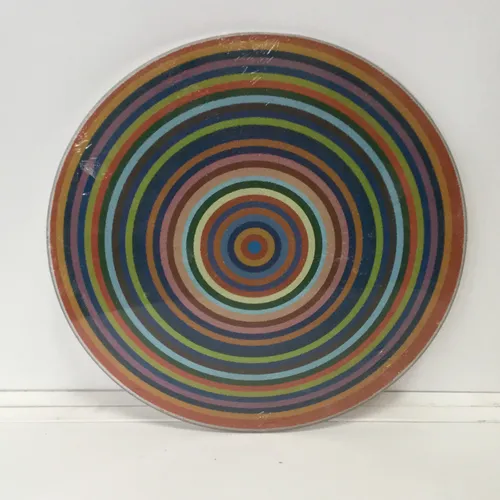 Circular glass chopping board with circle design 
