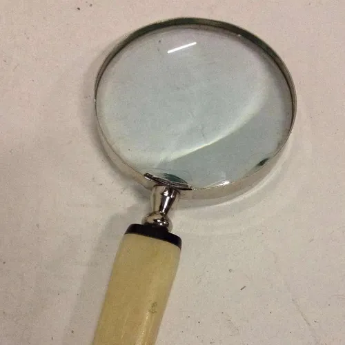 Period magnifying glass with silver frame and bone handle