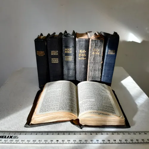Various black leather bibles with gold text (A6 size)