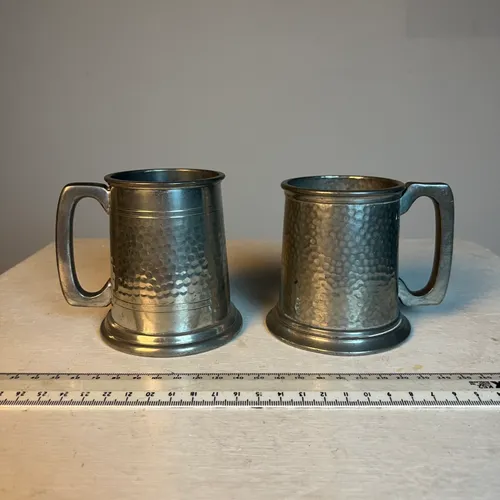 Set of two hammered, pewter beer mugs