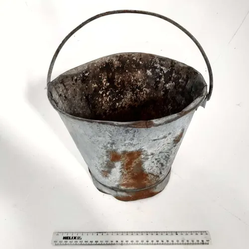 Old rustic dented metal bucket