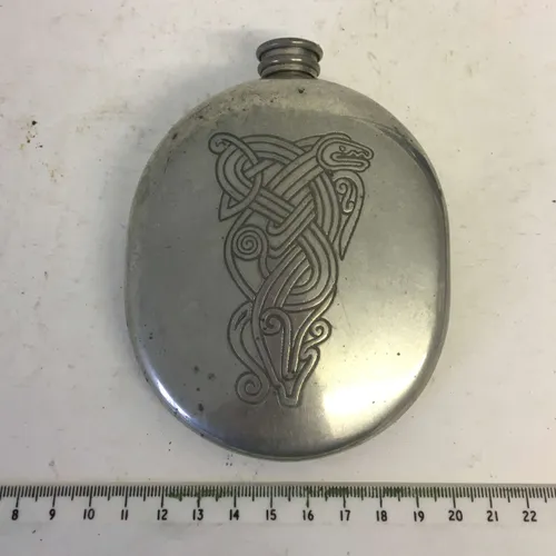 Round metal hip flask with Celtic engraving