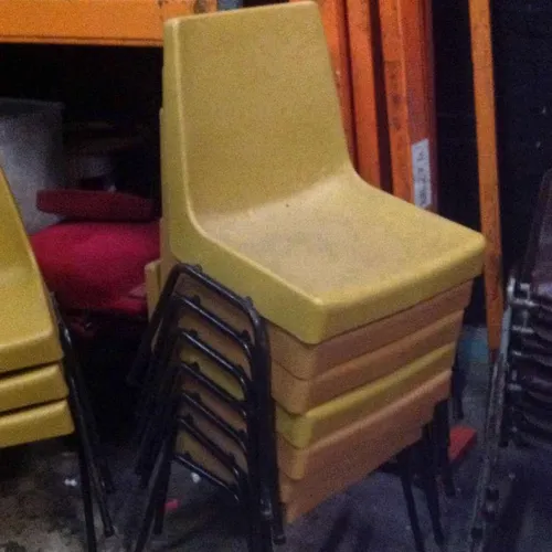 Period stacking chairs mustard yellow