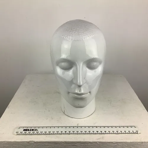 White glazed ceramic face head ornament 