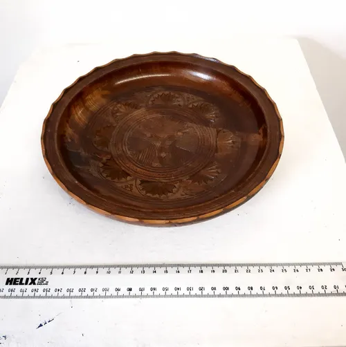 Wooden plate with engraved design 