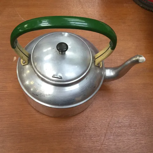 Silver teapot with green/yellow handle