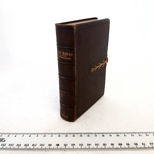 Brown leather hardback bible with gold clasp