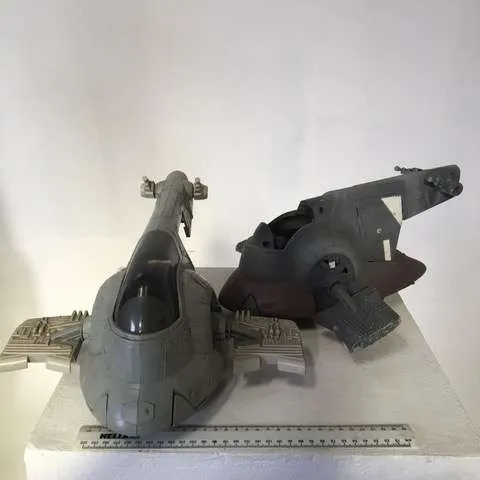 Grey plastic Star Wars vehicle toys (Slave I)