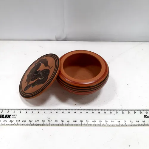 Small terracotta pot with lid