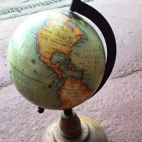 small globe on wood base